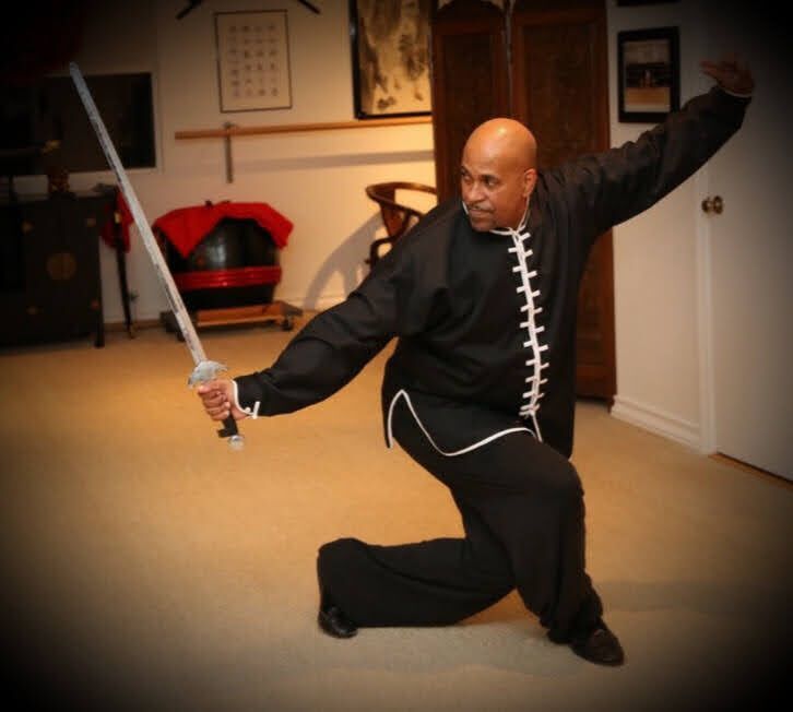 Sifu performing a traditional Chinese sword form at TruBalance Martial Arts